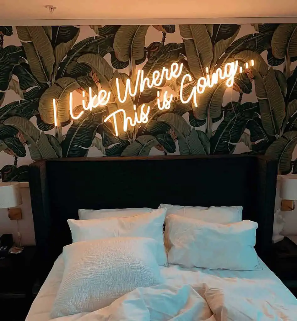 neon quotes over bed