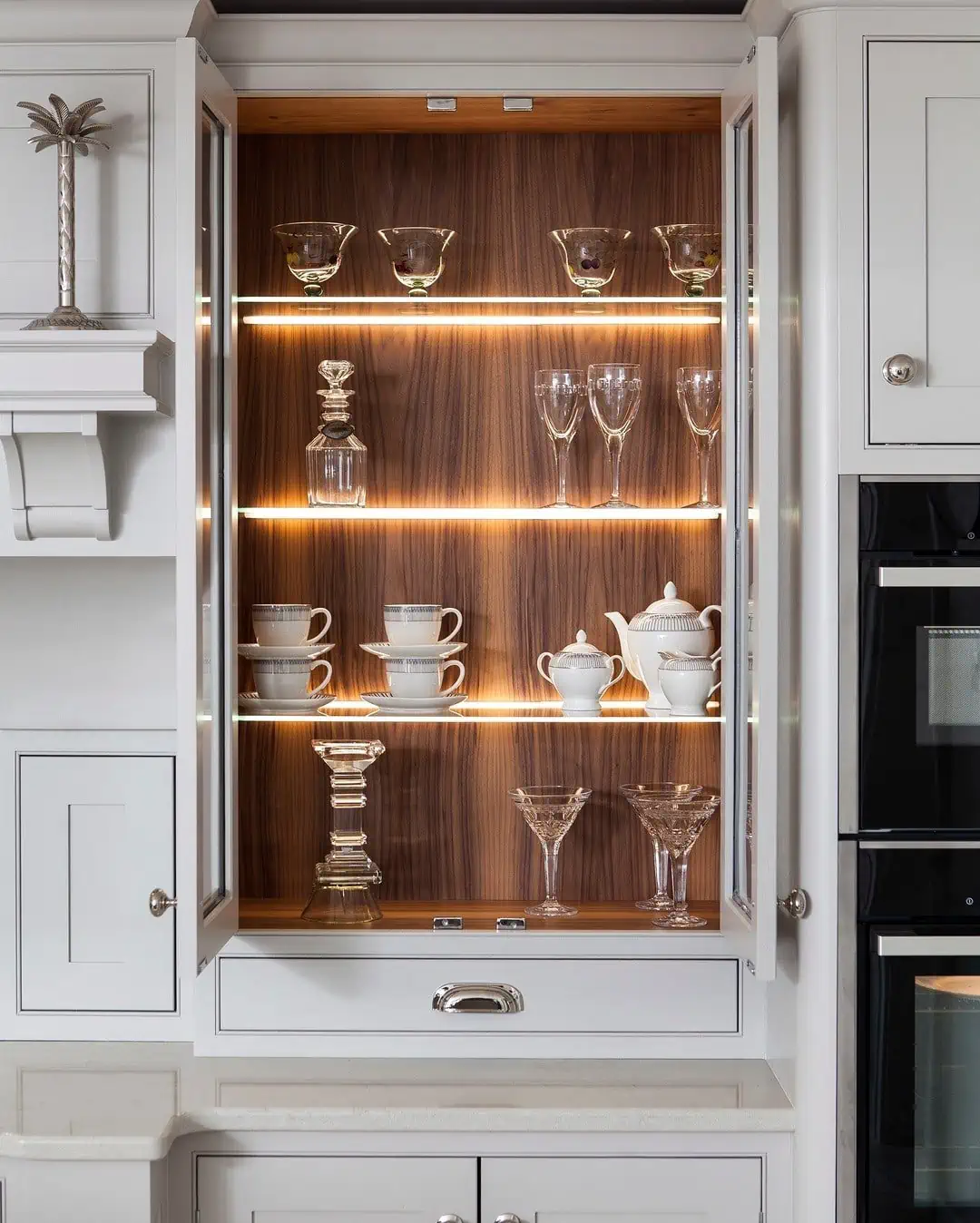 make a statement of dinnerware with cabinet lighting