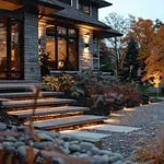 Modern home with illuminated garden pathways at dusk.
